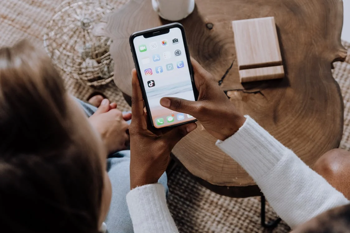 woman scrolling on phone